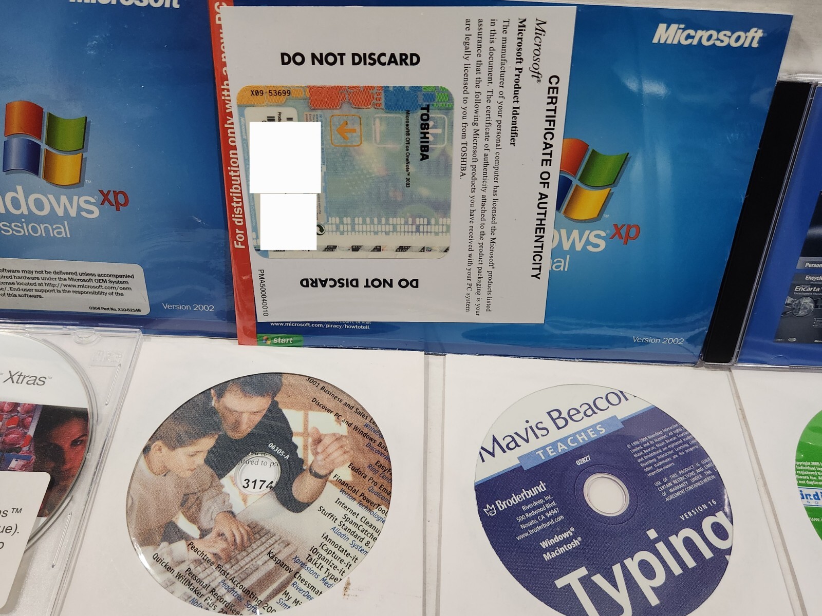 Huge Lot Of Software, Windows Xp PRO Microsoft Suite, Quicken, Games, Mavis ETC.