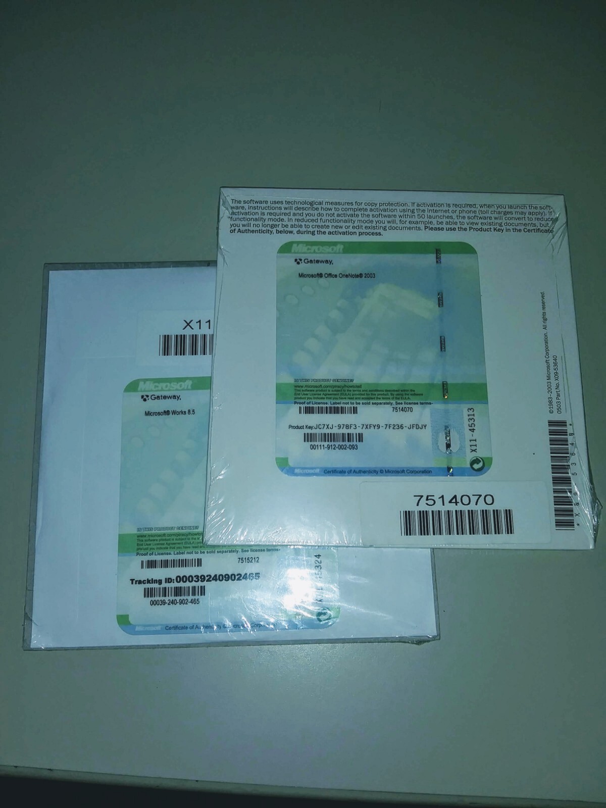New Sealed Microsoft Works 8.5 and Onenote 2003 on CDs